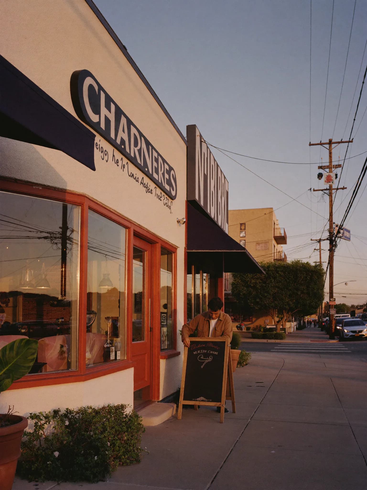 Local business storefront at dusk